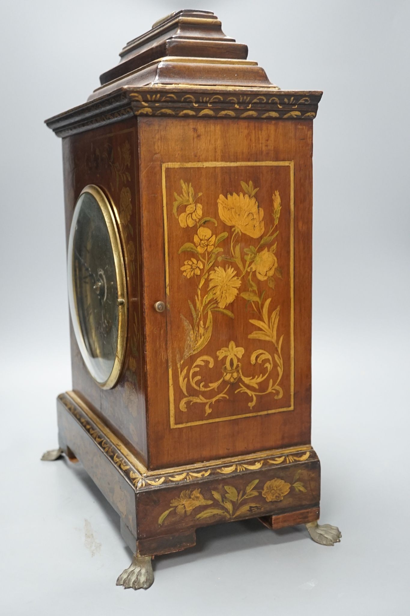 A Victorian floral painted mahogany bracket timepiece, with fusee movement, with key and pendulum, 49cm